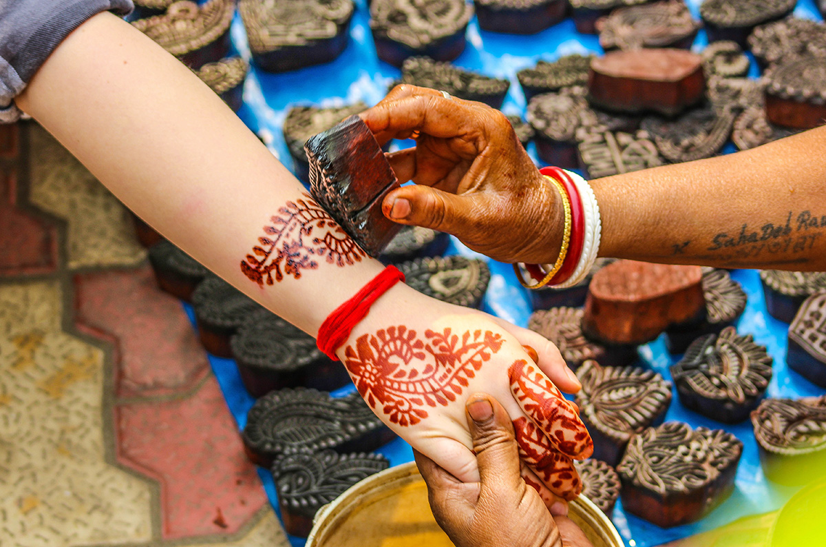 Applying Mehndi